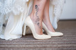 © o_lypa - Bride shows legs with tattoo in white shoes