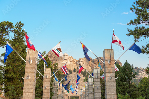 Fotografia, Obraz Row of state flags leading to Mount Rushmore in Keystone, South Dakota