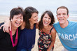 © nakophotography - Family laughing and having fun on the beach together