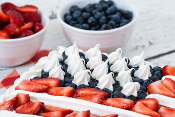 Patriotic American flag cake with blueberries and strawberries