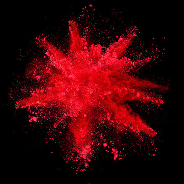 explosion of red powder on black background