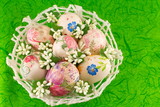 Fototapeta Storczyk - Decorated Easter eggs in a basket