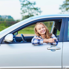 Young woman driving a car