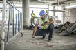 © Westend61 - Construction worker spaying marks on floor in construction site