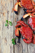Boiled crabs on wooden surface. top view