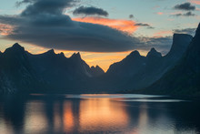 Beautiful Sunset Near The Great Mountains And Clear Silence Water At Reine, Lofotens. Amazing Nature Of Norway. Cloudscape