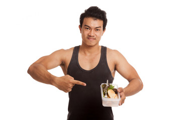 Muscular Asian man point to  clean food in box