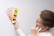 © vimax001 - Woman holding color samples against the wall