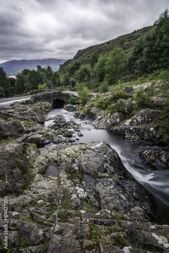 Fotografie, Obraz Dramatic clouds over Catbells from Ashness Bridge in Keswick, Lake District, UK
