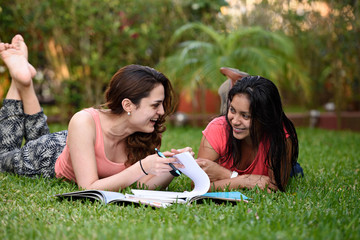 happy girl learning in grass