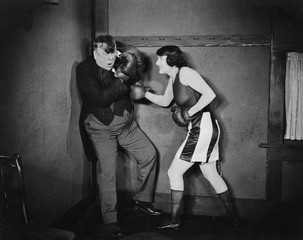 Man and woman boxing 