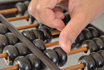 Hand calculated on Old wooden abacus