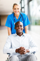 Wall Mural - medical nurse with male patient in wheelchair