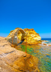 Wall Mural - beautiful old bridge made of stone in the sea at Chora, the capital of Andros island in Greece