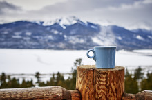 A Steaming Cup Of Coffee In The Mountains