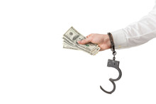 Hand With Money In Handcuffs