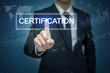 Businessman hand touching CERTIFICATION  button on virtual scree