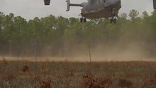 The Osprey CV-22 Helicopter Lands In A Field.