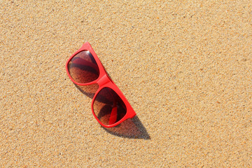 Wall Mural - Red sunglasses on the beach