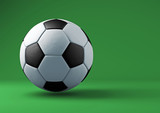 Fototapeta Sport - Soccer ball with shadows on green background.