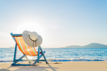 Deck chair at the tropical sandy beach