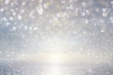 Wall Mural - glitter vintage lights background. silver, blue and white. defocused.
