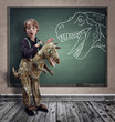 © Brian Jackson - Surprised boy dressed in fancy dress as a dinosaur