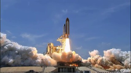 the space shuttle lifts off from its launchpad.