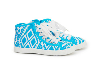 Sports sneakers in blue thick fabric. Presented on a white backg