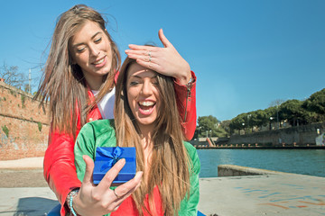 best friends forever - happy girl gets a surprise gift from her college girl friend - friendship lov