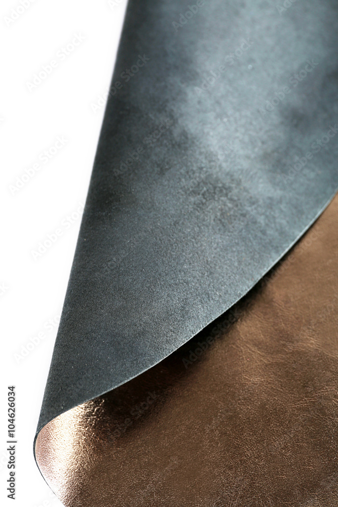 Dark brown shiny leather  texture on white background, close up