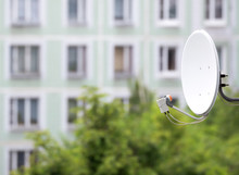 Satellite Dish On The Background Of An Apartment House