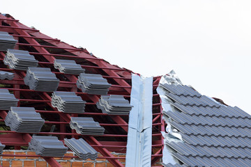 Sticker - black tile roof on residential building construction house