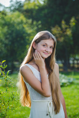 Young girl in a summer park