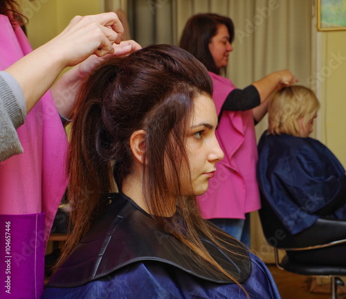 Hairdressers Work With Customers In A Salon Buy This Stock Photo