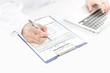 © karnstocks - Selective focus at hand of Doctor checking new patient history f