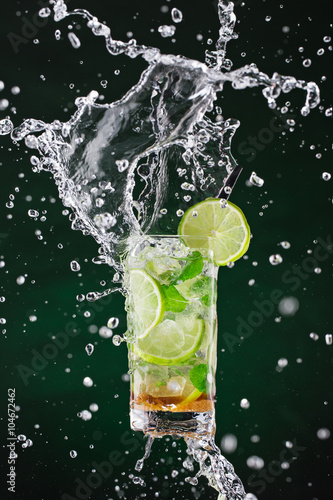 Fotografie, Tablou fresh mojito drink with liquid splash, freeze motion.