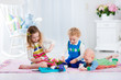 © famveldman - Children playing toy tea party