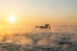 © toshket - The ship sails at dawn in the fog of the cold winter sea.Estoni