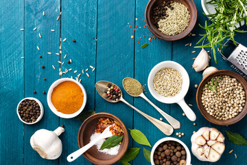 Poster - culinary background and recipe book with various spices on wooden table