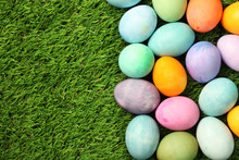 Colorful Easter Eggs On Grass Background