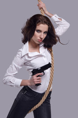 Poster - Young  sexy Woman holding Handgun in hand