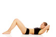 © Piotr Marcinski - Woman exercising and doing a crunch to work her abs