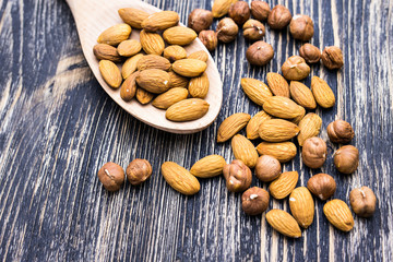 Almonds on wooden background