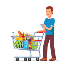 Young Man Pushing Supermarket Shopping Cart