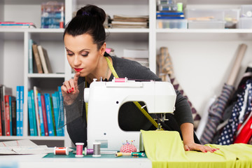 Young woman at a sewing machine