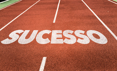 Wall Mural - success (in portuguese) written on running track