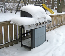 A Backyard Barbecue Covered In Snow.