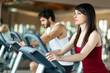 © Minerva Studio - Group of people running on treadmills