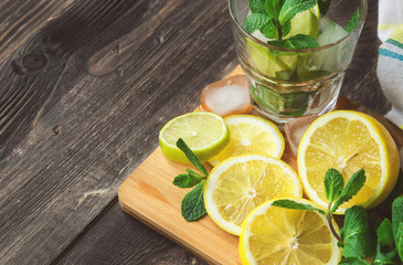 Wall Mural - Lemon slices, mint leaves and ice cubes